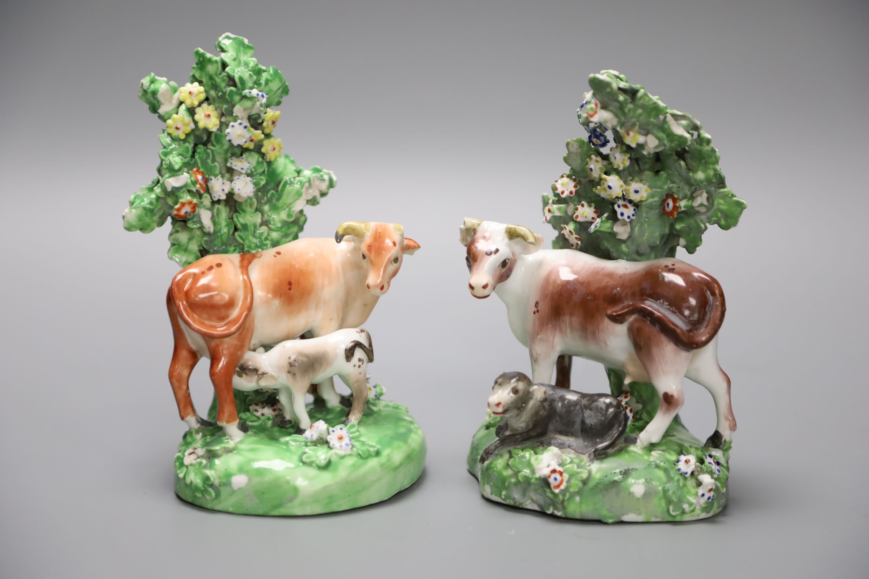 A 19th century Derby pair of cow and calf groups, height 15cm